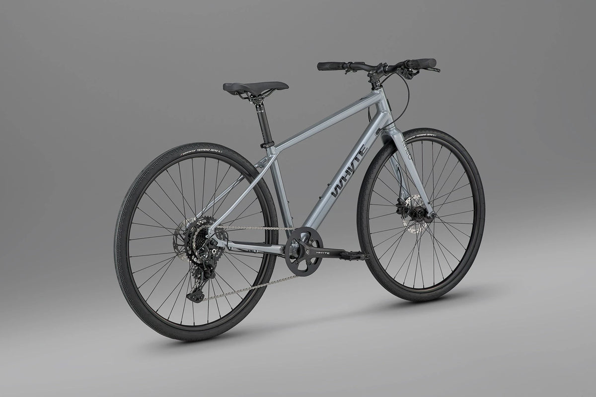 Whyte RHeO 0 hybrid bike in dark silver from a rear three-quarter angle, showing the 1x9 Shimano CUES drivetrain.