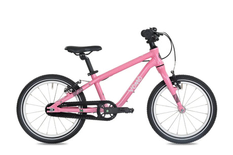 Yomo 16 inch kids bike in pink, side view on a white background