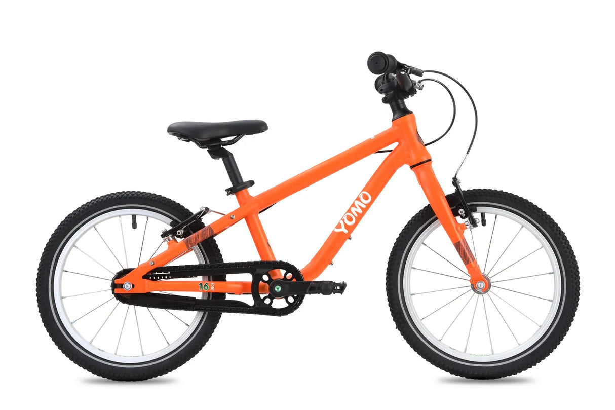 Yomo 16 inch kids bike in orange, side view on a white background