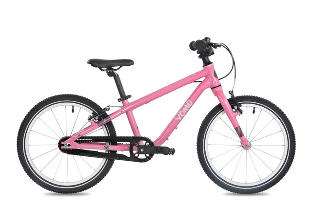 Yomo 18 inch kids bike in pink, side view on a white background