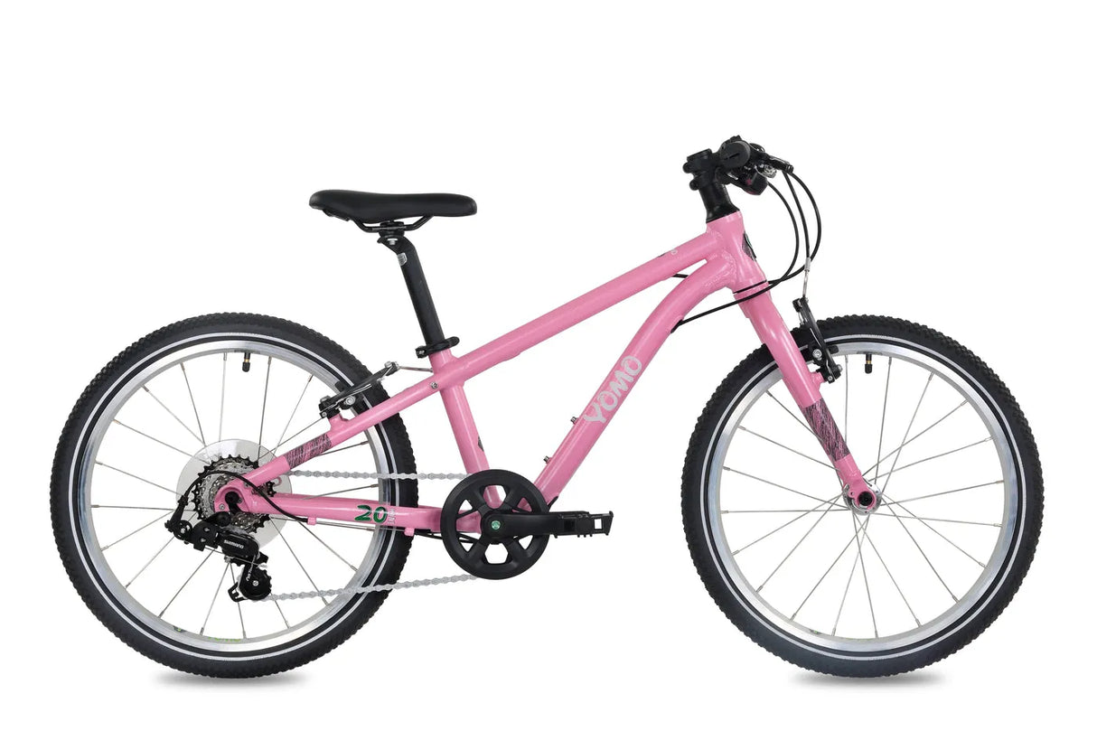 Yomo 20 inch kids bike in pink, side view on a white background
